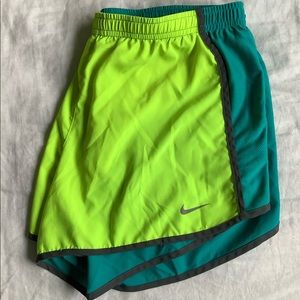 Neon green and turquoise Nike running shorts